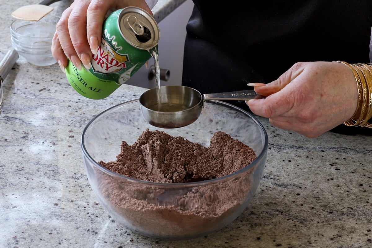 adding ginger ale to the dry ingredients