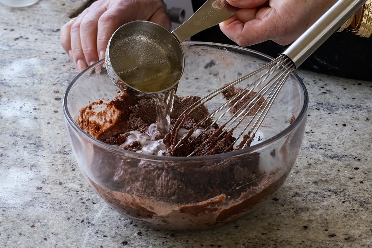adding the remaining wet ingredients to the dry ingredients