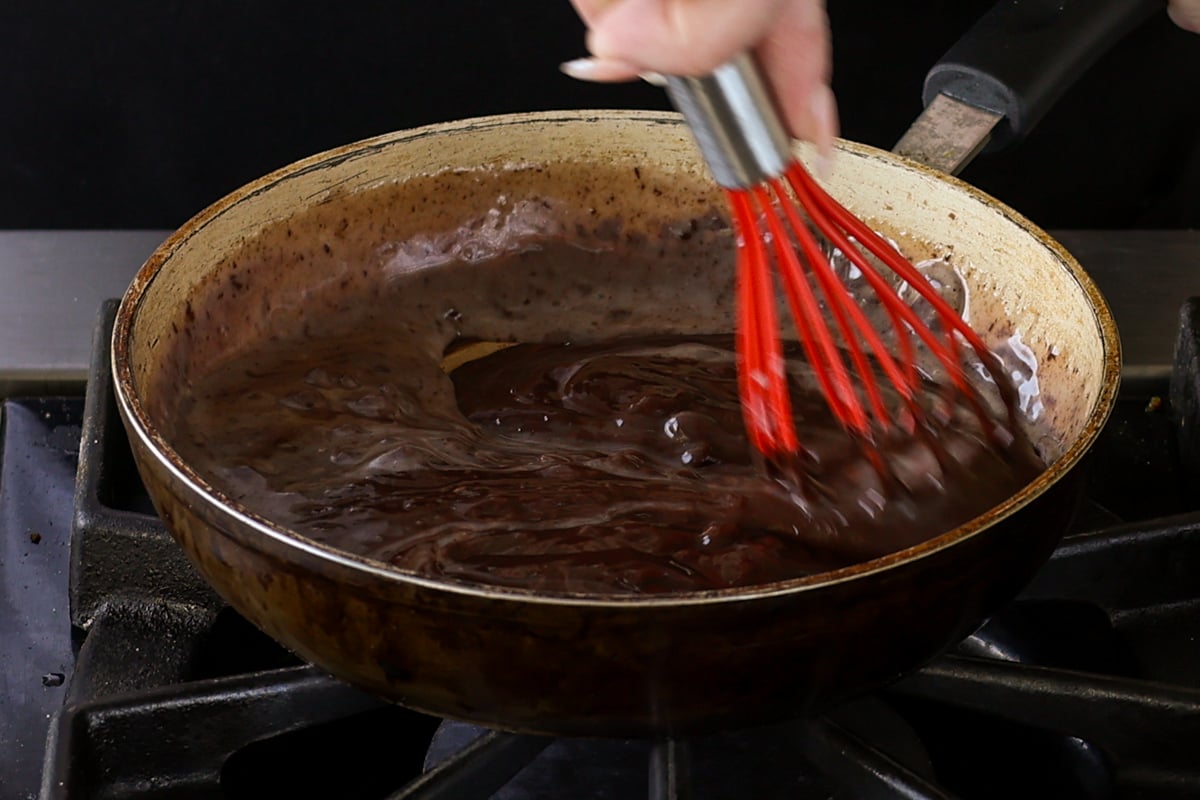 chocolate ganache frosting in the pan