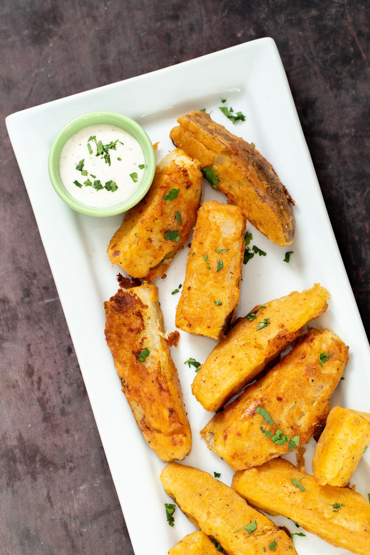 jo jo potatoes Jo Jo Potatoes served on a white platter with a side dish of vegan ranch