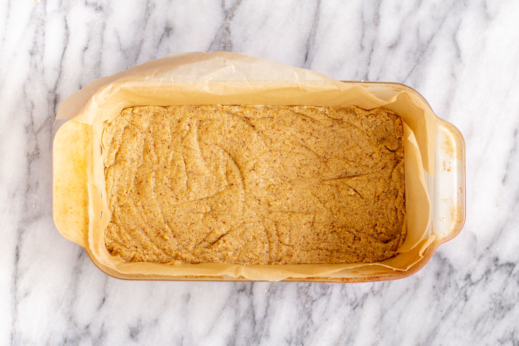 vegan lemon bars  vegan cookie crust pressed in a pyrex loaf pan