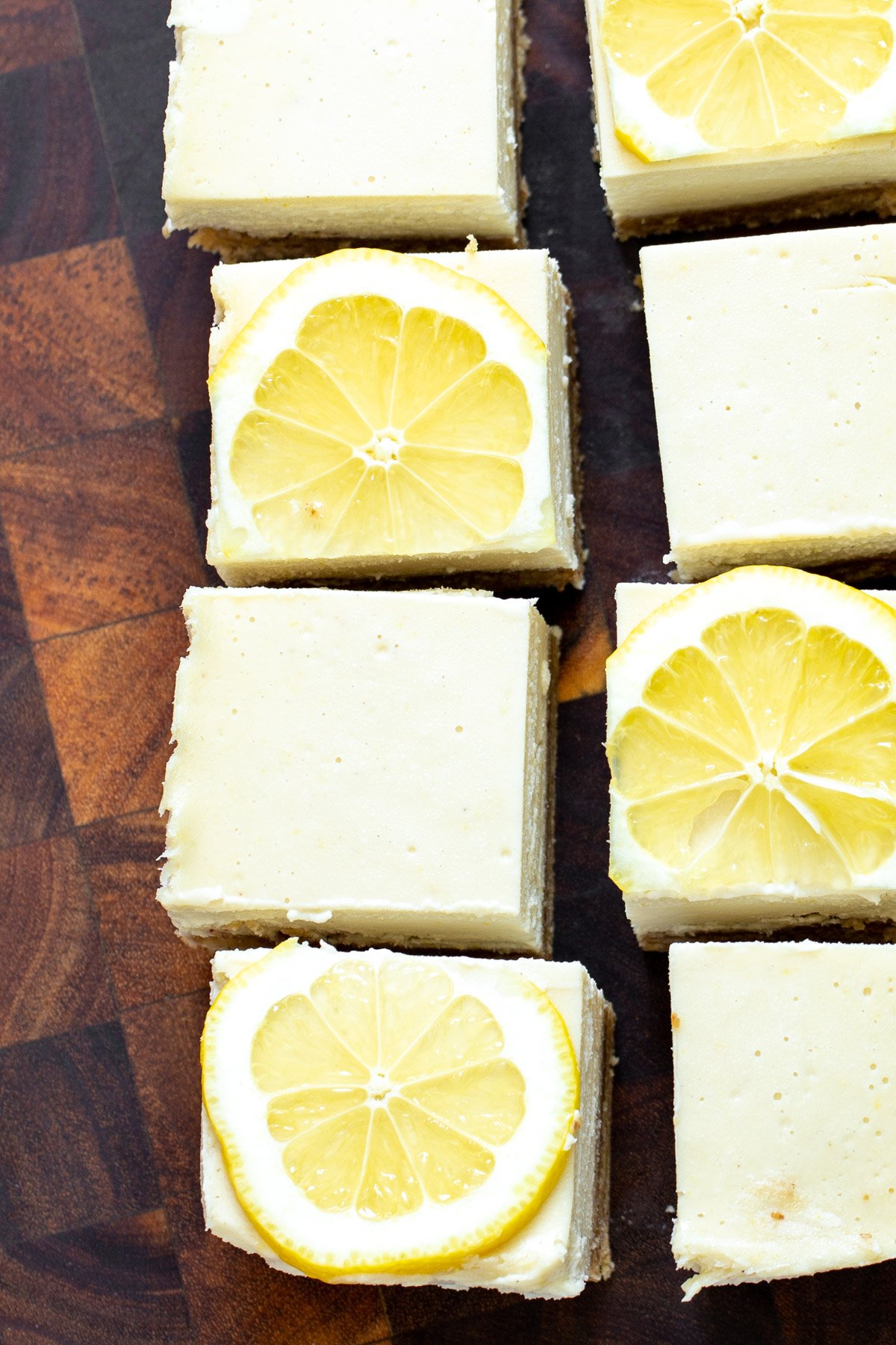 vegan lemon bars  freshly cut vegan lemon bars topped with lemon slices