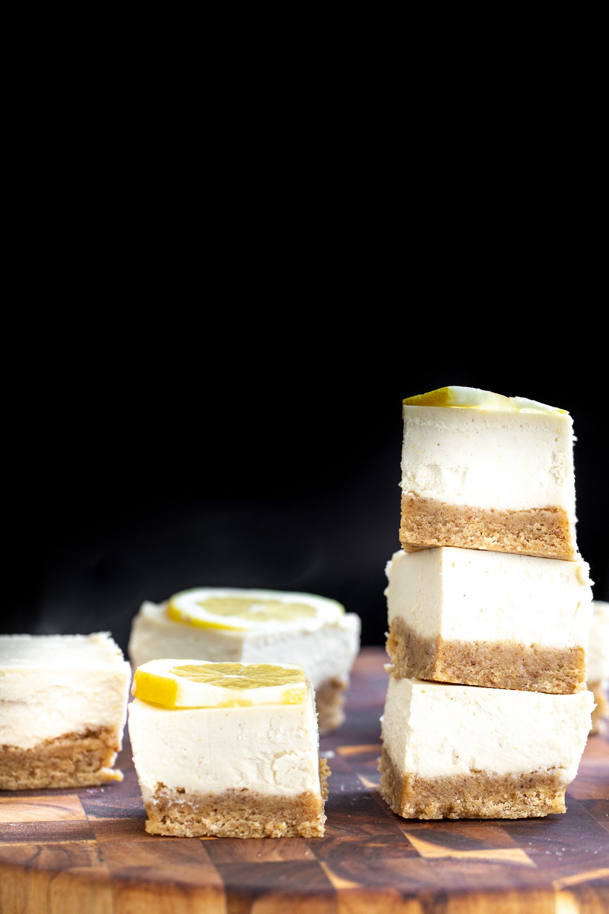 vegan lemon bars  vegan lemon bars on a wooden chopping board