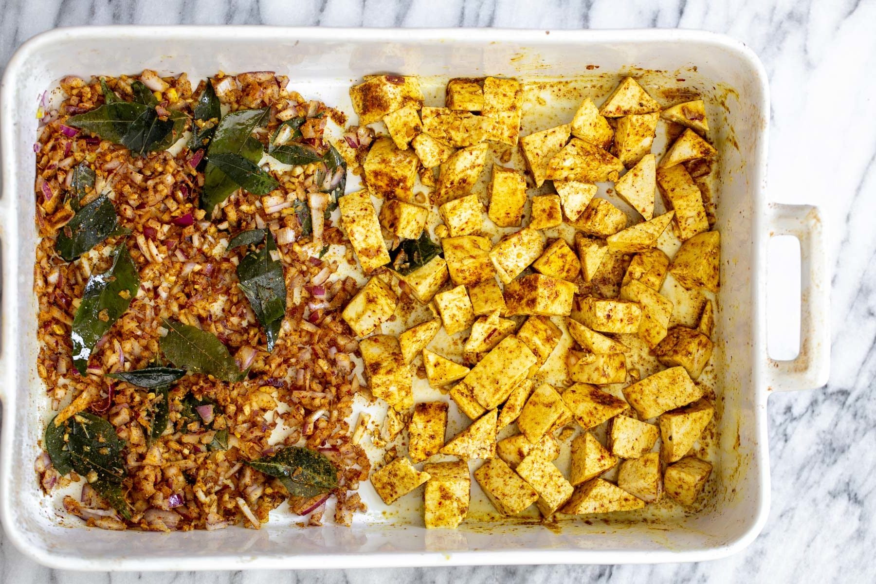 tofu casserole  casserole dish with curry spiced baked tofu and onions