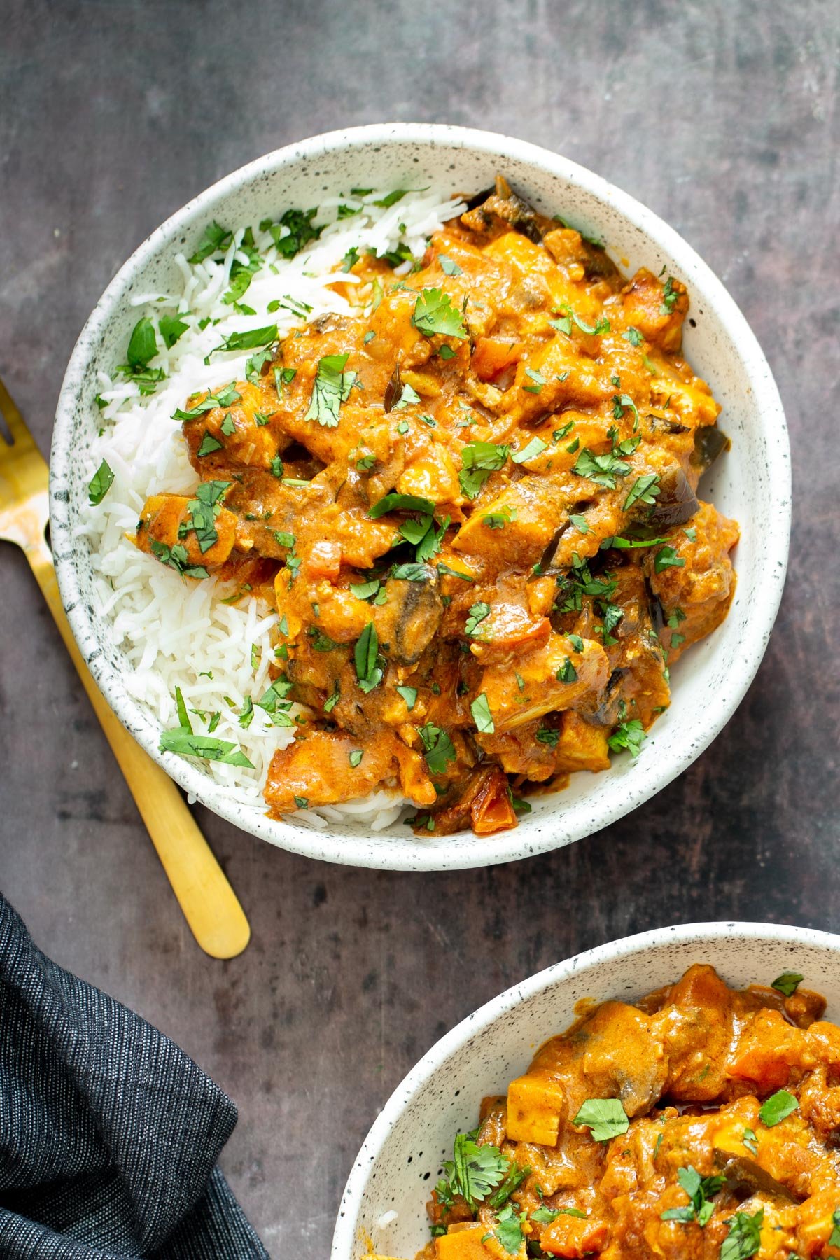 tofu casserole  a serving of rich Indian Madras Curry tofu casserole served with rice and fresh cilantro