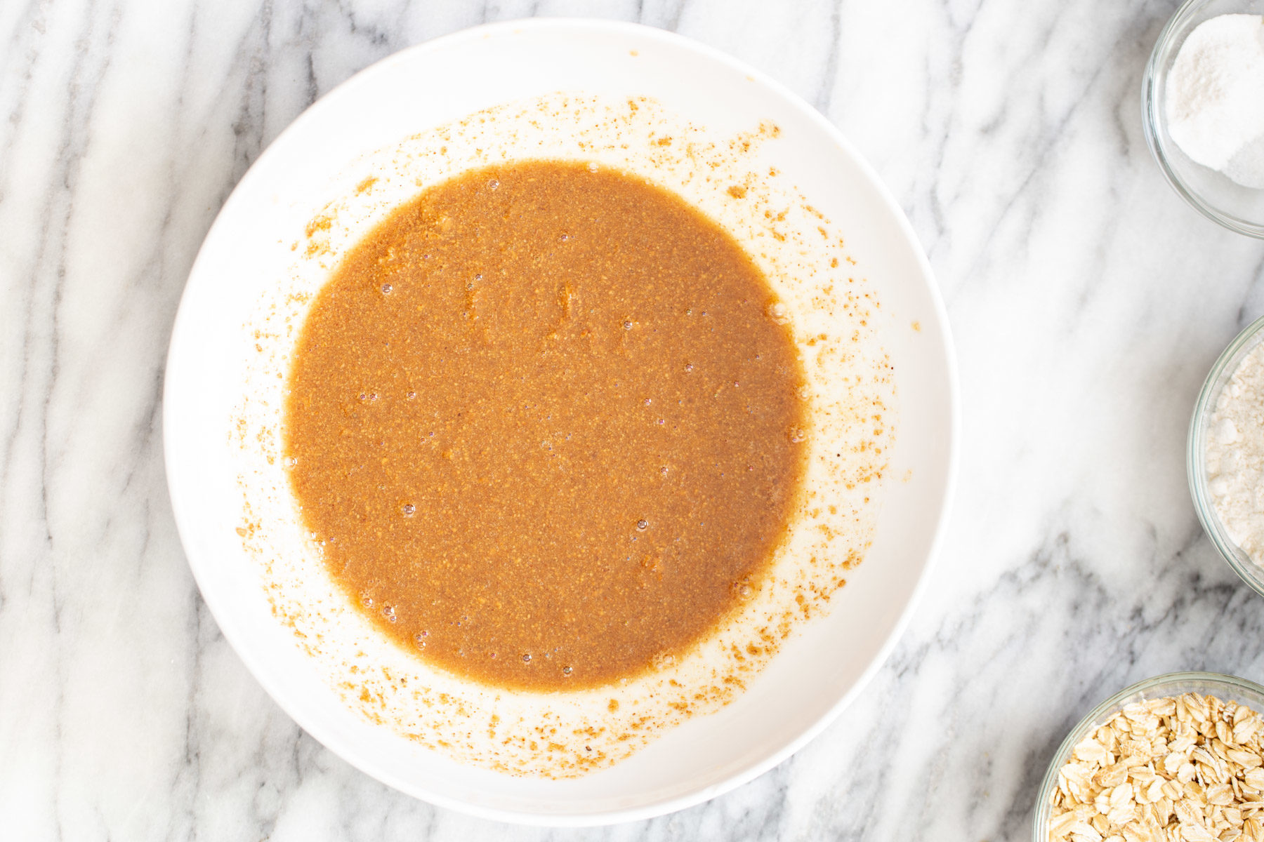 wet ingredients for vegan date caramel oatmeal bars being mixed 