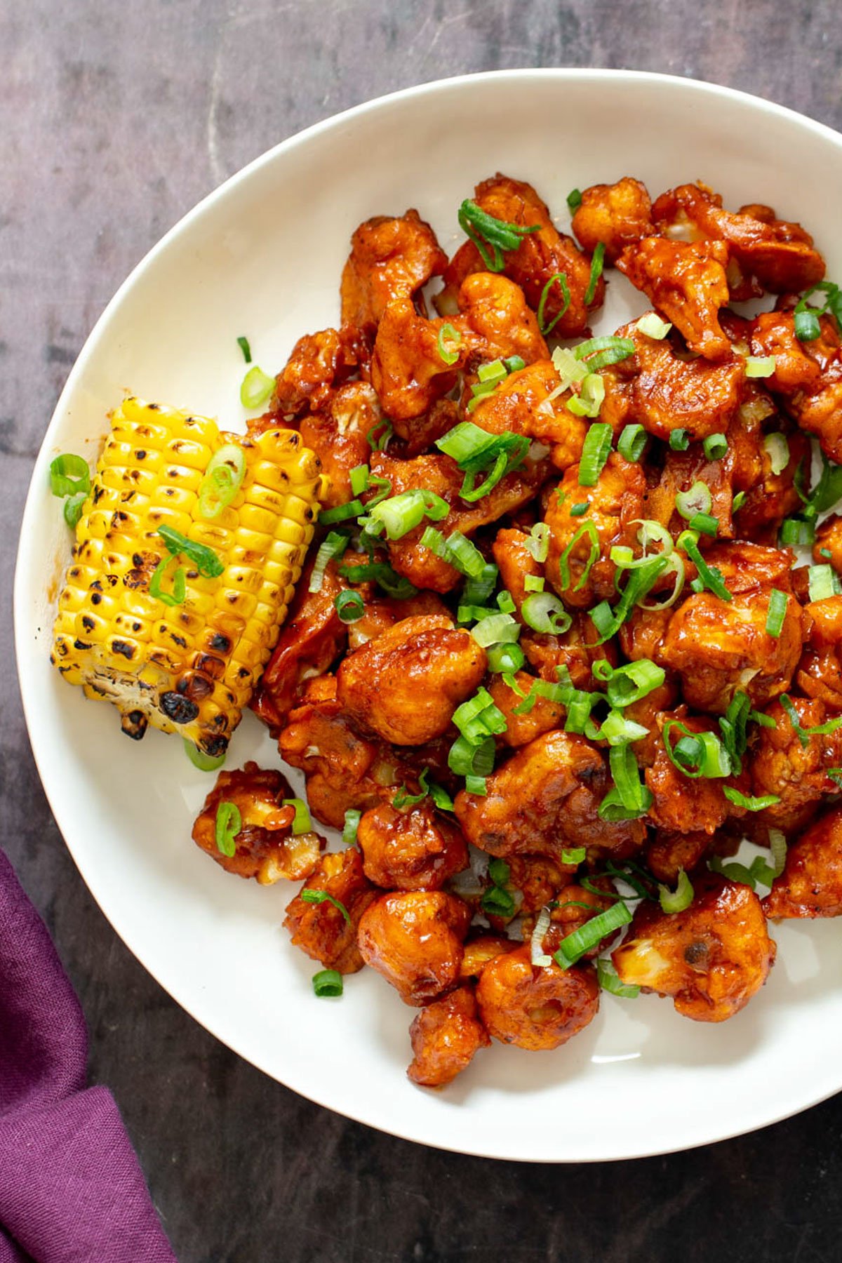 cauliflower wings  beer battered bbq cauliflower wings served with a piece of grilled corn on the cob