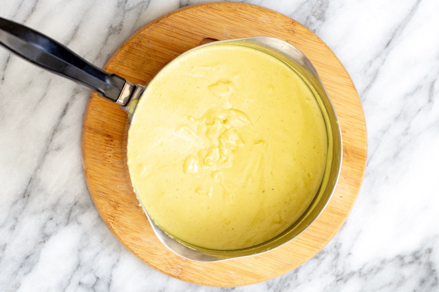 saucepan with vegan cheese sauce
