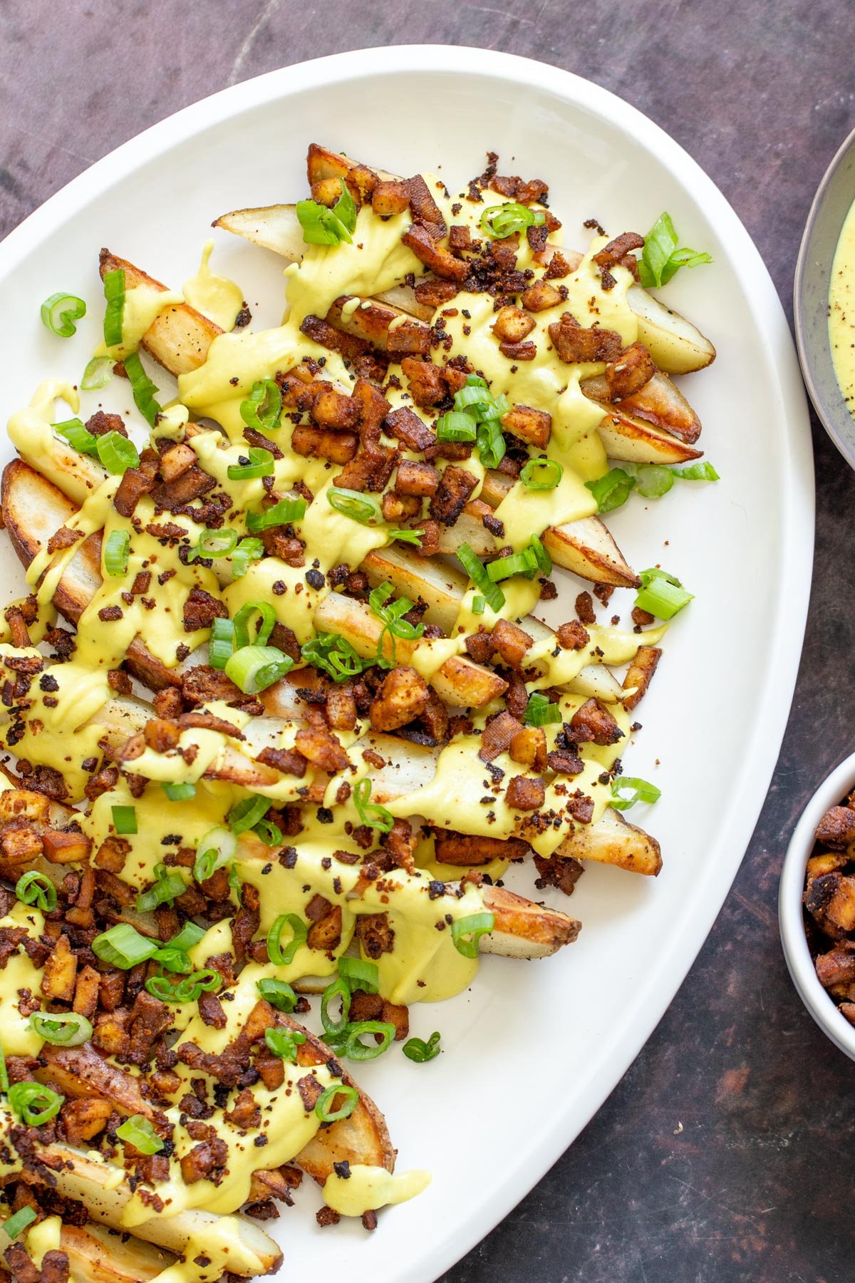 loaded potato wedges  loaded potato wedges drizzled with vegan cheese sauce