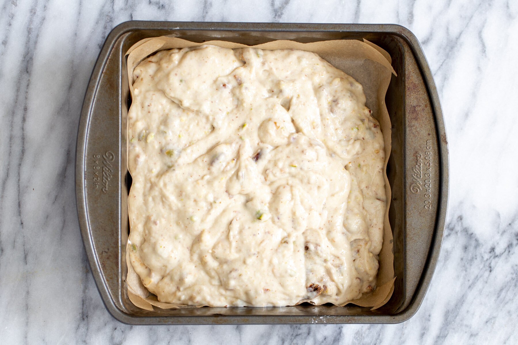 date nut cake  vegan date nut cake batter in a cake pan