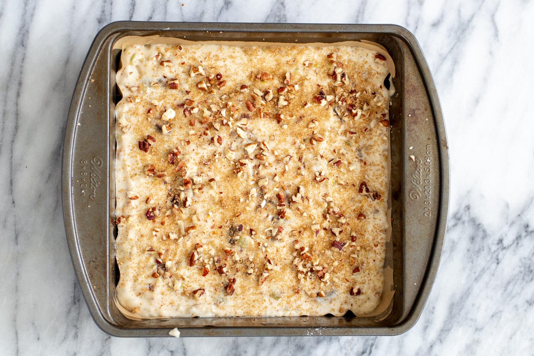 date nut cake  vegan date nut cake batter in a cake pan ready to be baked