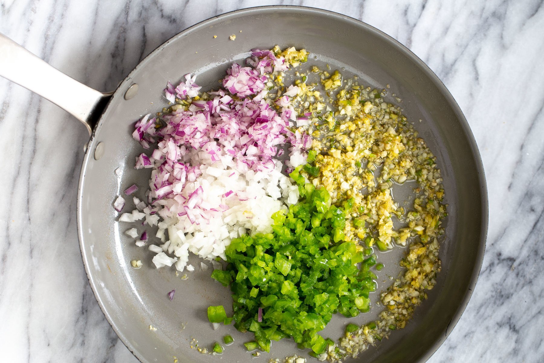 cauliflower manchurian  minced chili, garlic, ginger and onions in a sauteeing pan