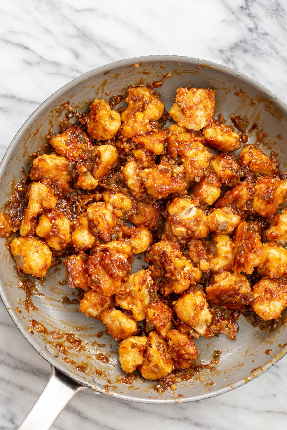 cauliflower manchurian  vegan cauliflower manchurian in a saucepan