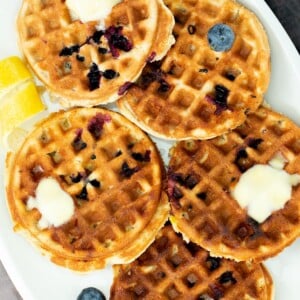 a plate of gluten-free lemon blueberry waffles