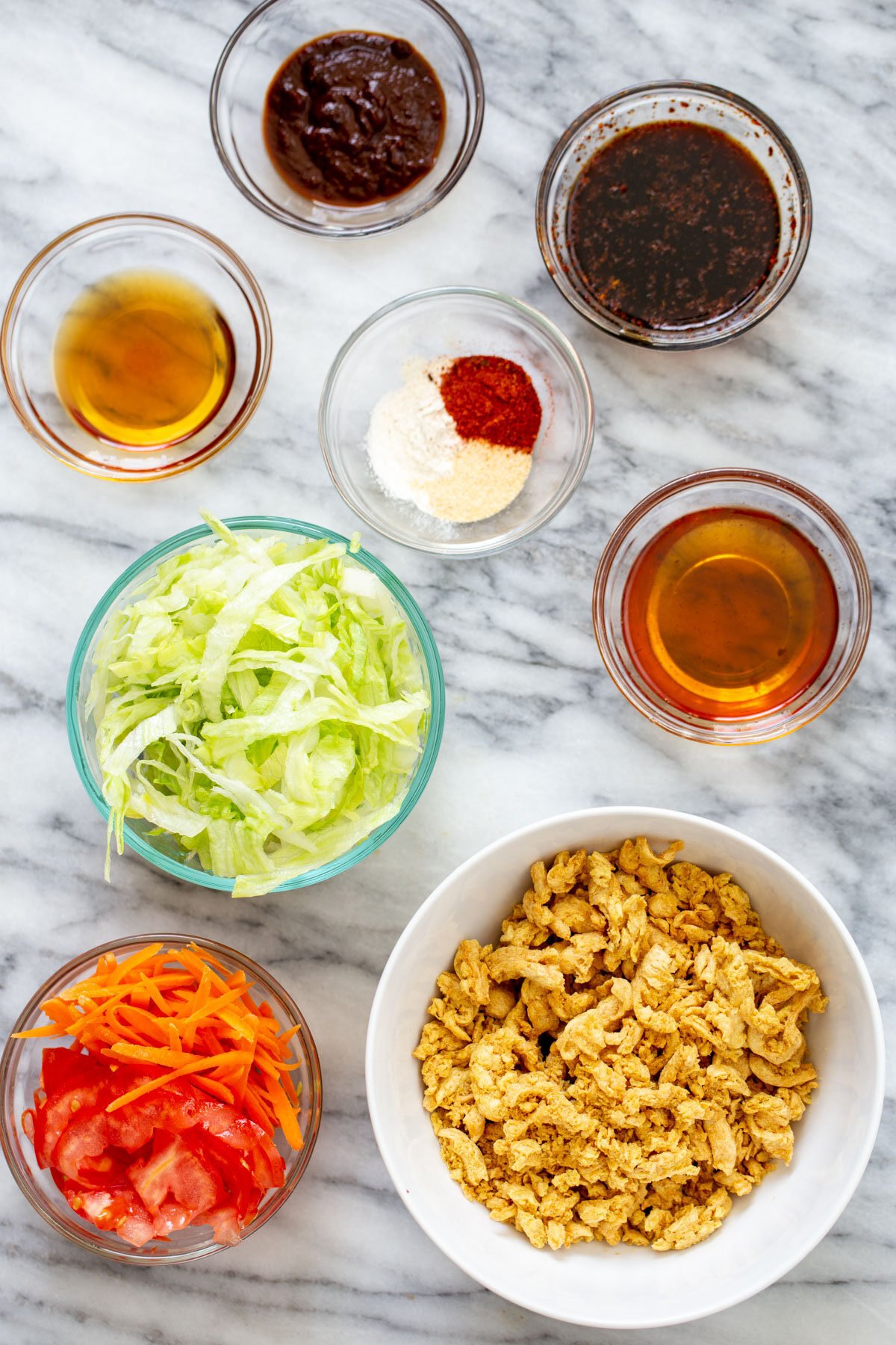 vegan crunchwrap ingredients for making vegan crunchwraps on a marble countertop