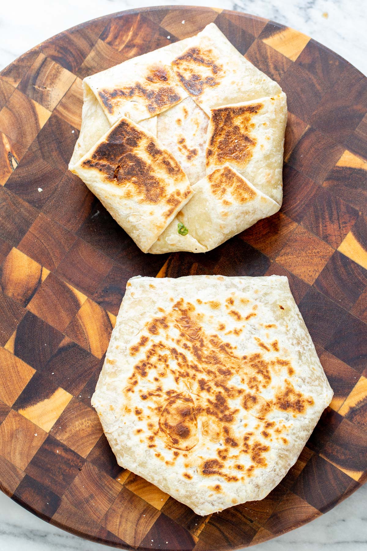 vegan crunchwrap two vegan crunchwraps placed on a wooden board