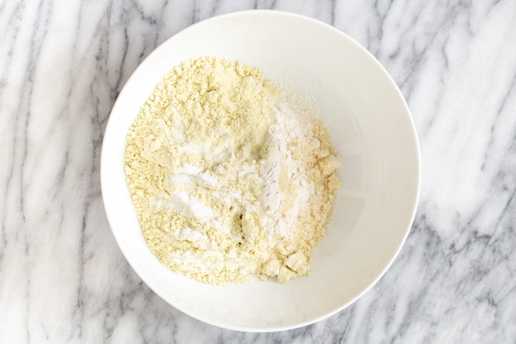 pistachio cookies dry mix for vegan pistachio cookies in a white bowl