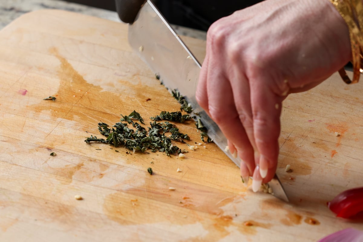 mincing the basil