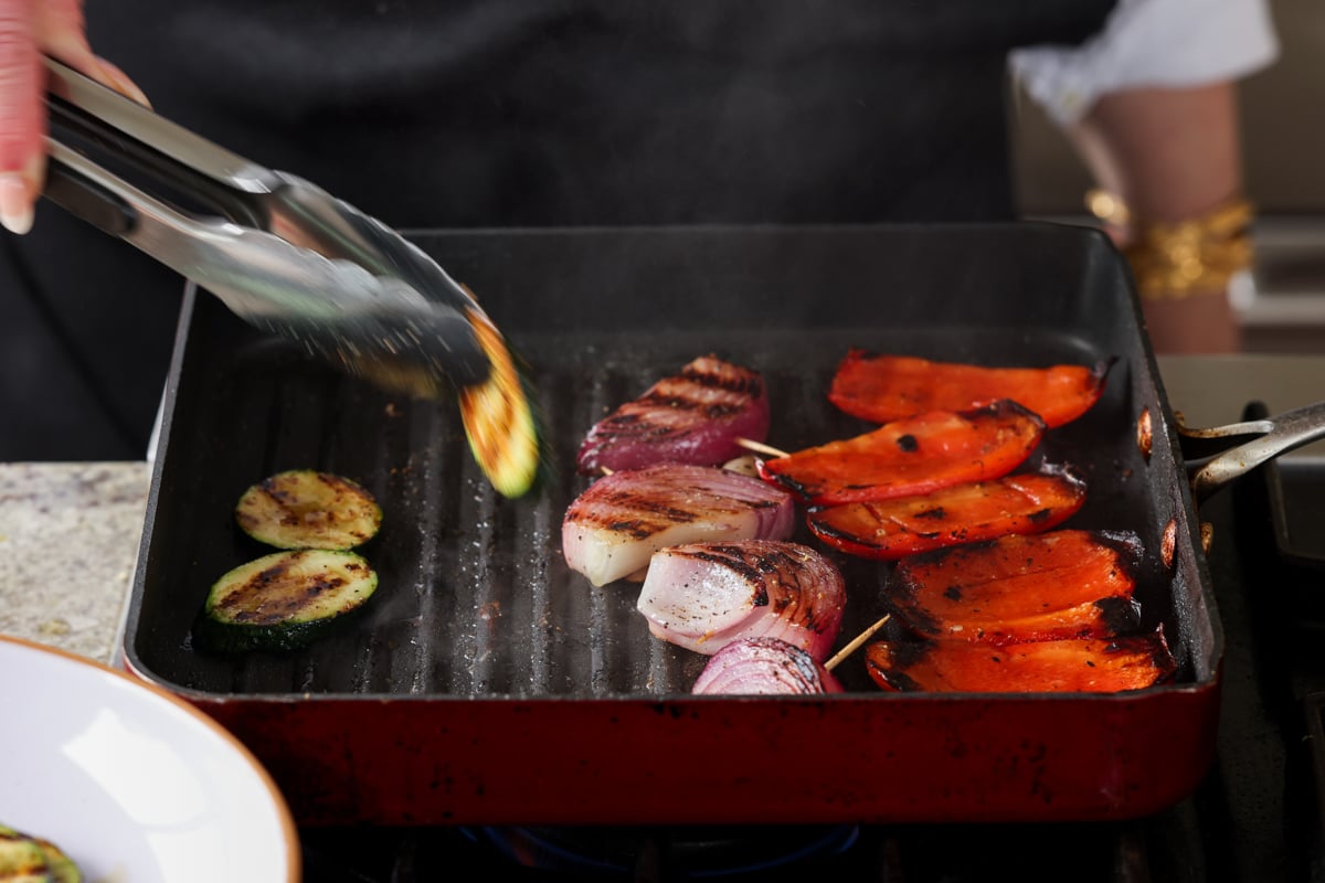 removing the cooked vegetables from the grill pan