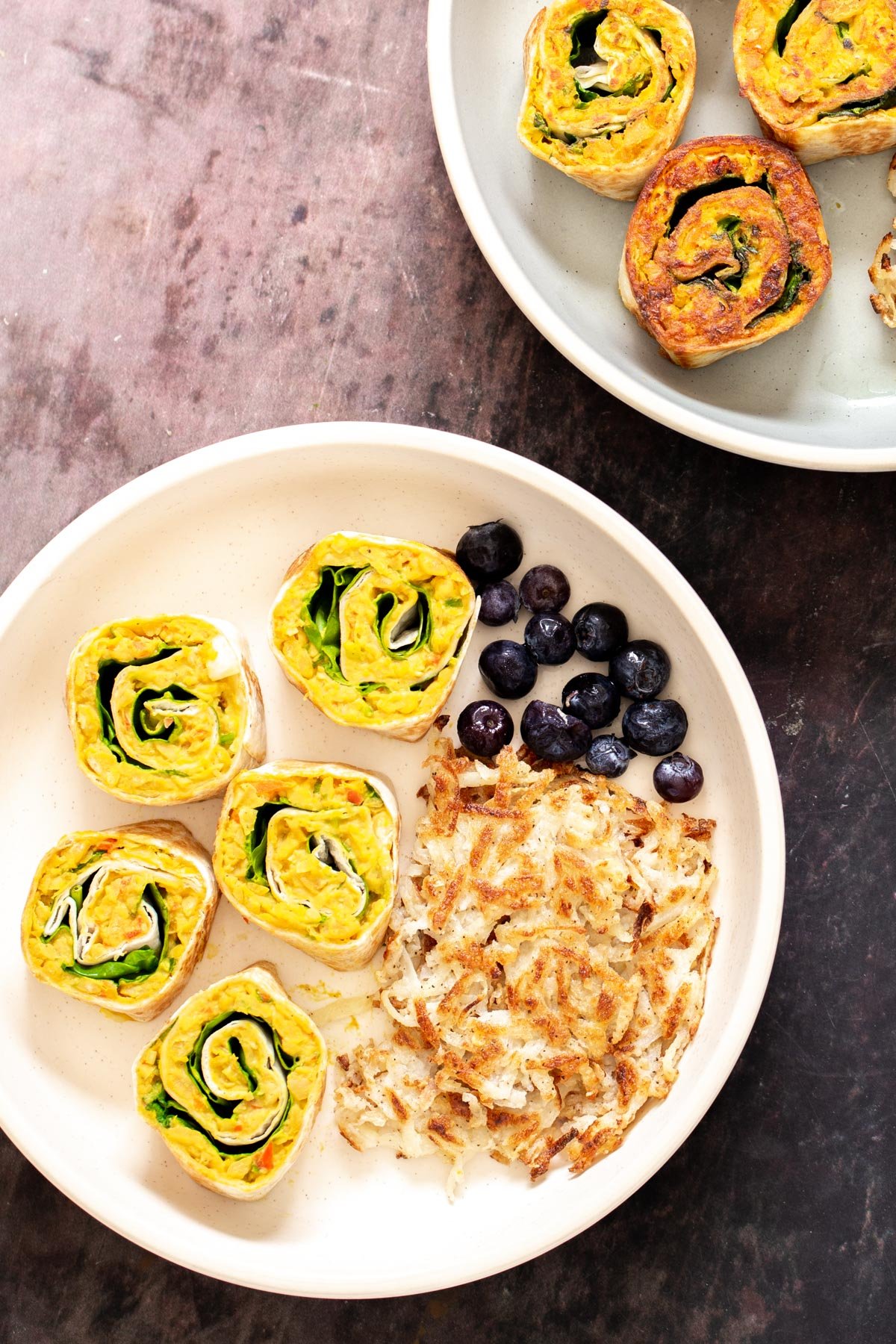 chickpea breakfast  vegan chickpea breakfast platter with vegan chickpea scramble pinwheels, hash brown and berries