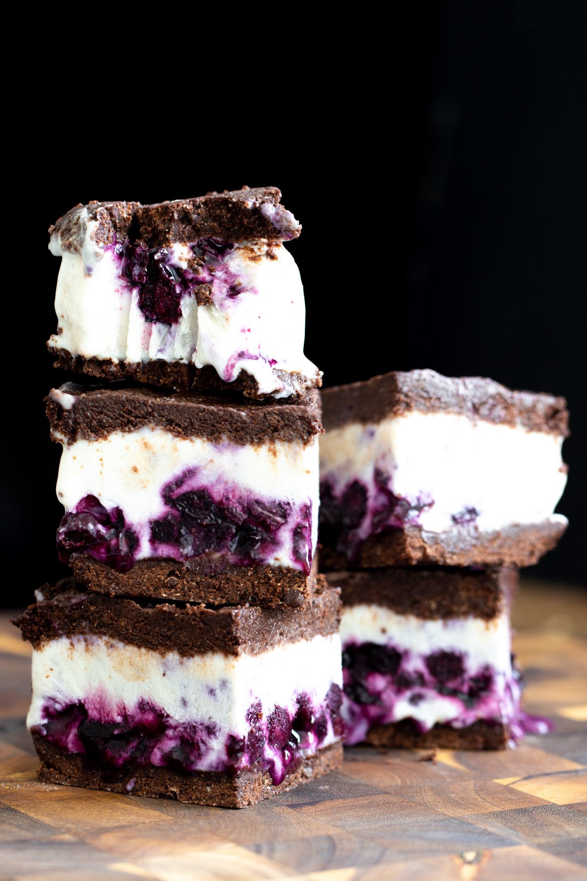 vanilla ice cream sandwiches vegan chococolate vanilla ice cream sandwiches on a wooden board