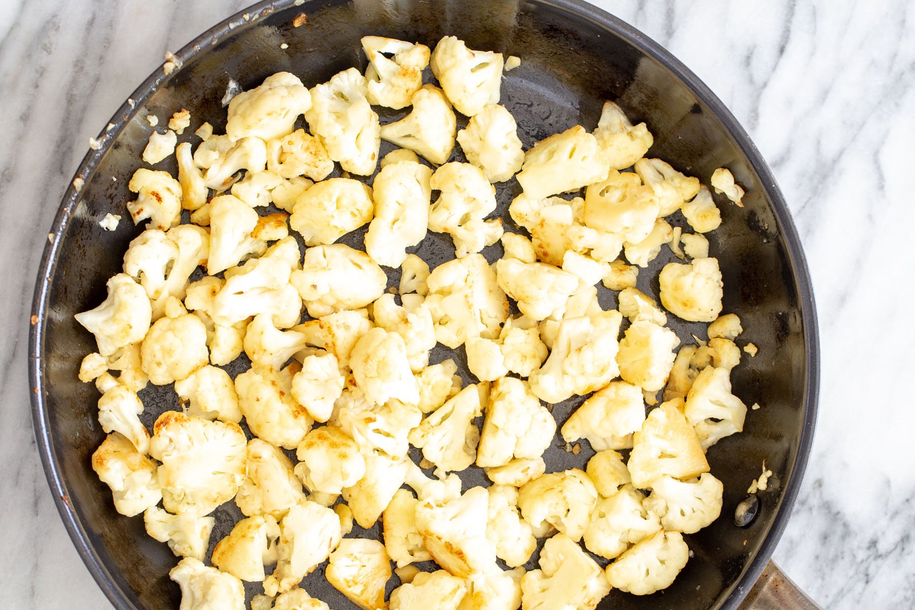 Cauliflower in saute pan for Gobi do pyaza