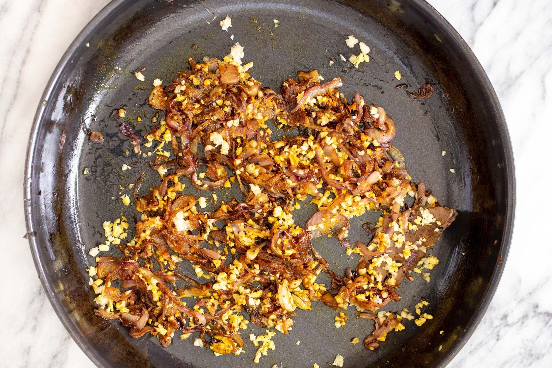 fried onion, ginger and garlic in a saucepan