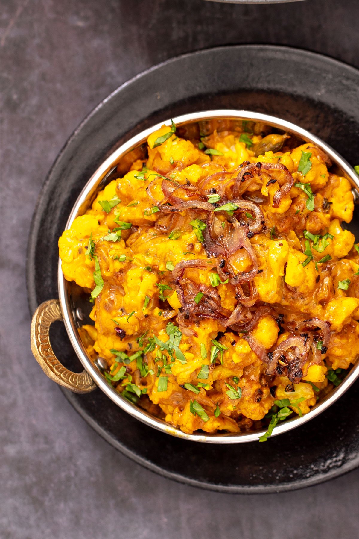 Indian gobi do piaza cauliflower curry with onion gravy served in an Indian dish