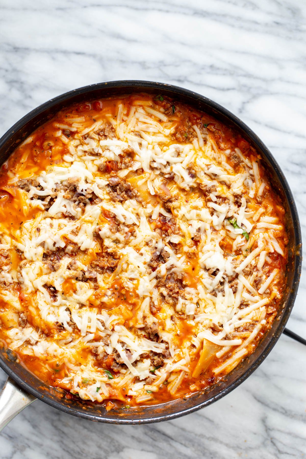 vegan skillet lasagna vegan skillet lasagna with vegan cheese shreds in a black iron skillet