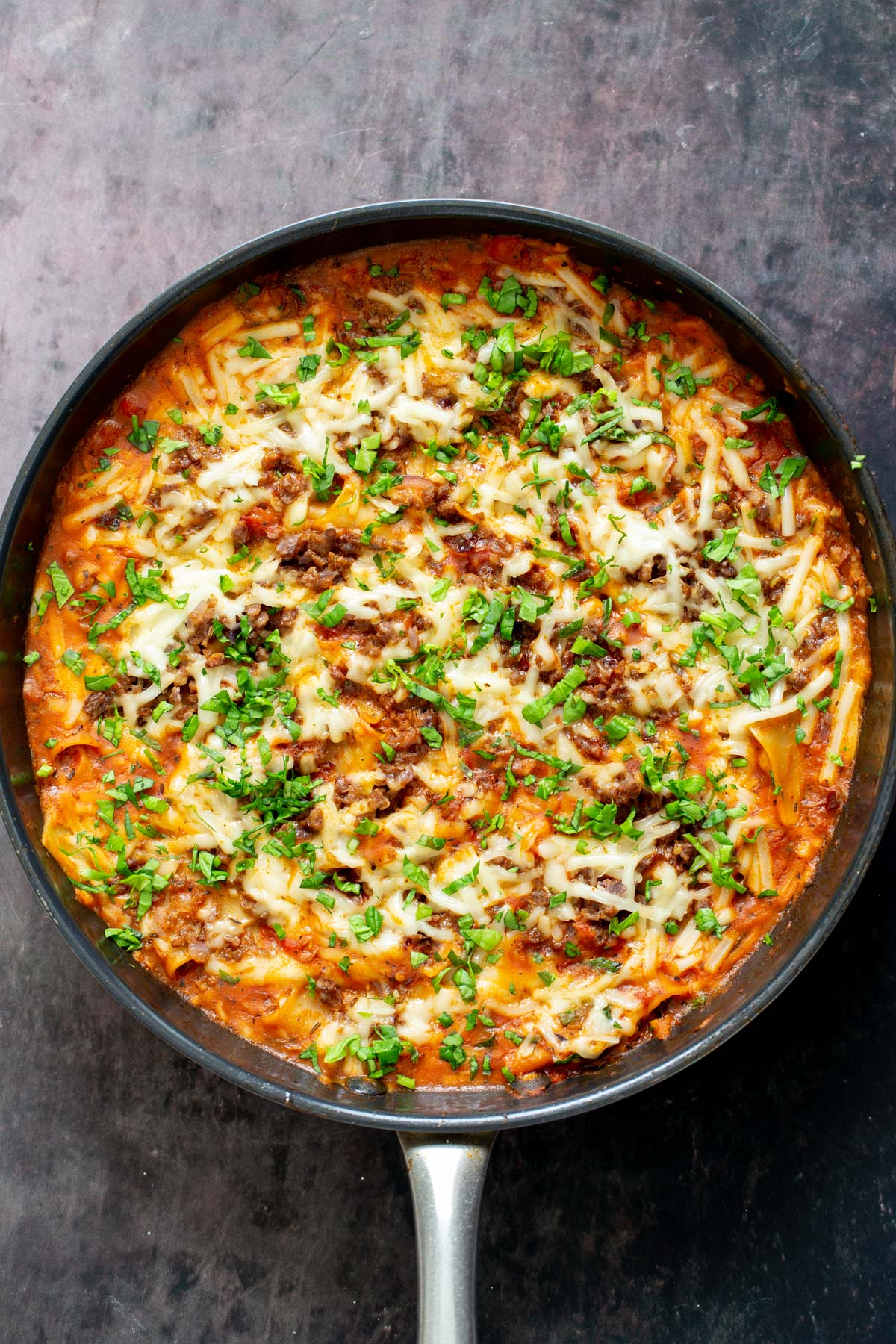vegan meat lasagna with vegan bolognese made in a black skillet