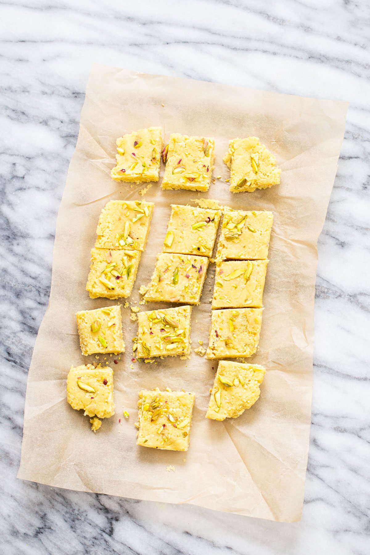 almond burfi almond burfi on a piece of parchment paper cut into squares