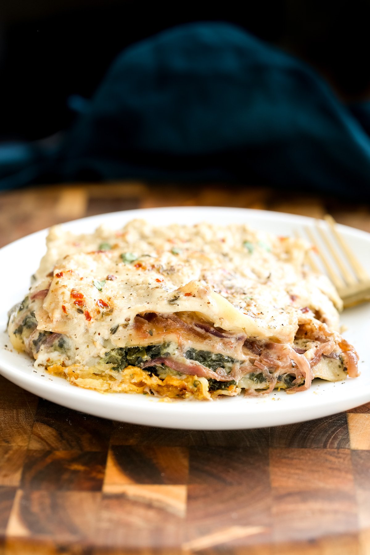 vegan butternut squash lasagna side view of a serving of vegan butternut squash lasagna