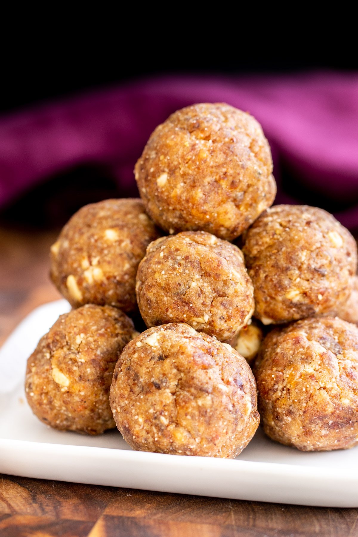 date ladoo stacked Indian Date Ladoos on a white plate
