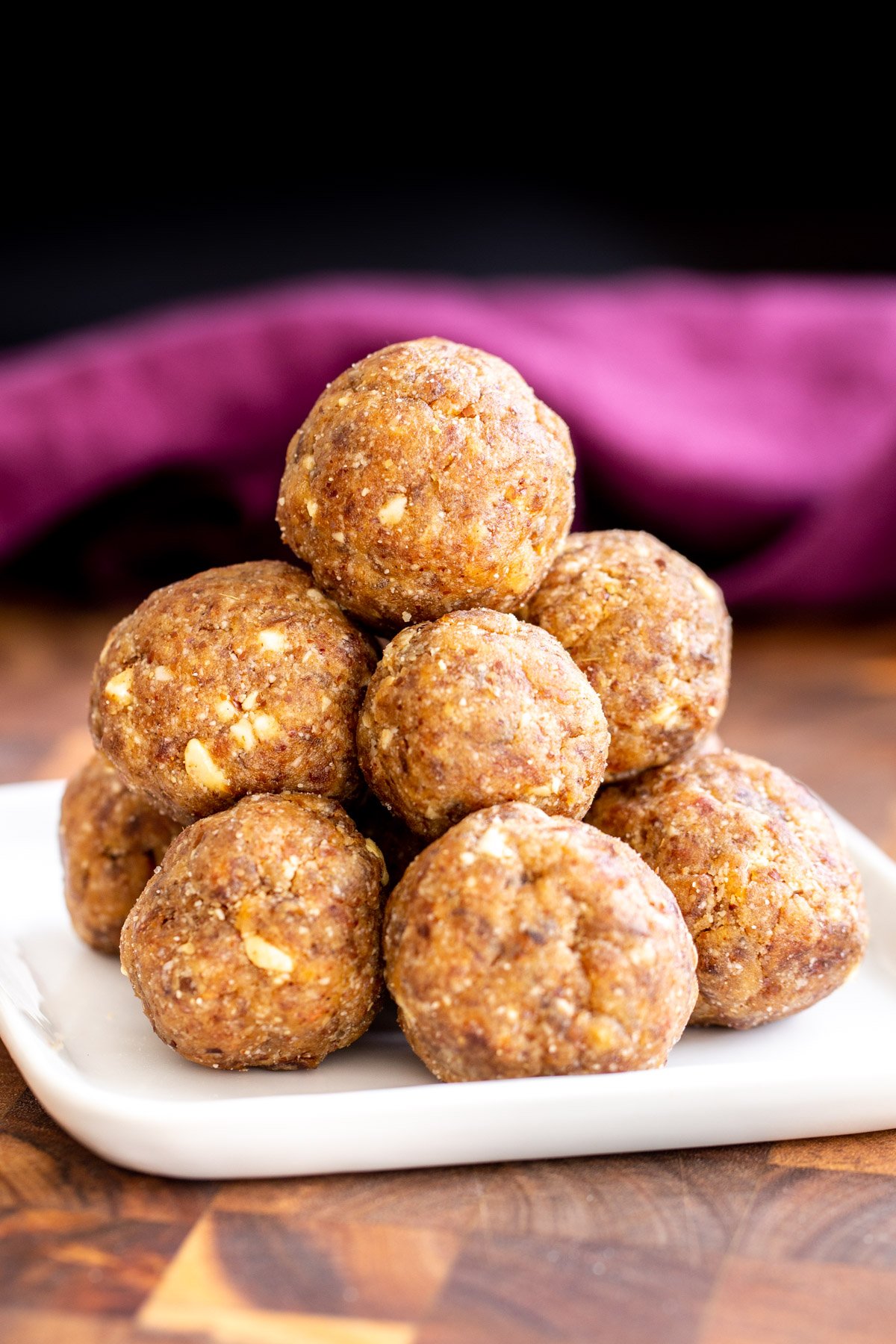 date ladoo  vegan whole wheat date ladoo on a small plate