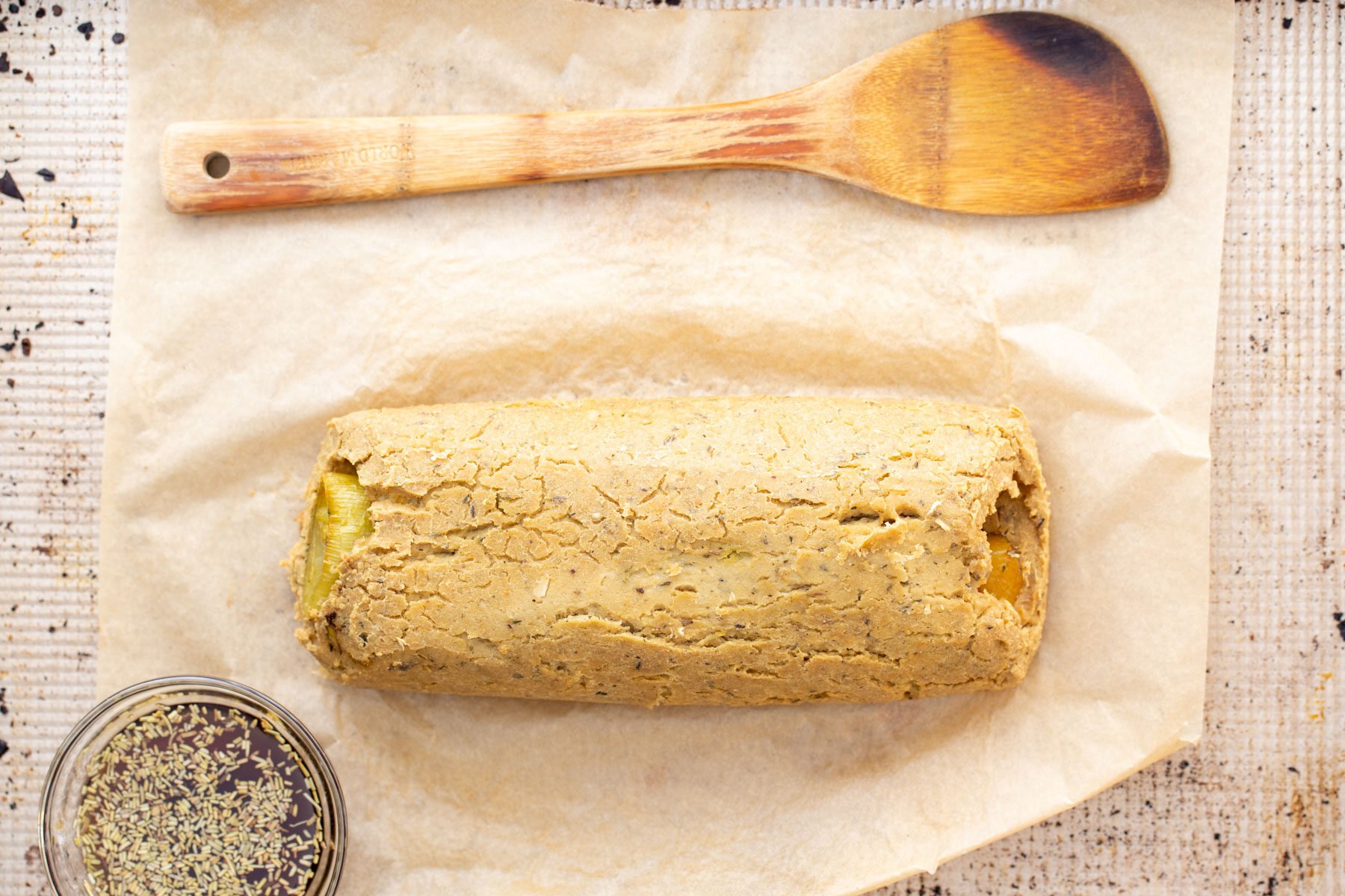 vegan chickpea roast on a sheet or parchment paper