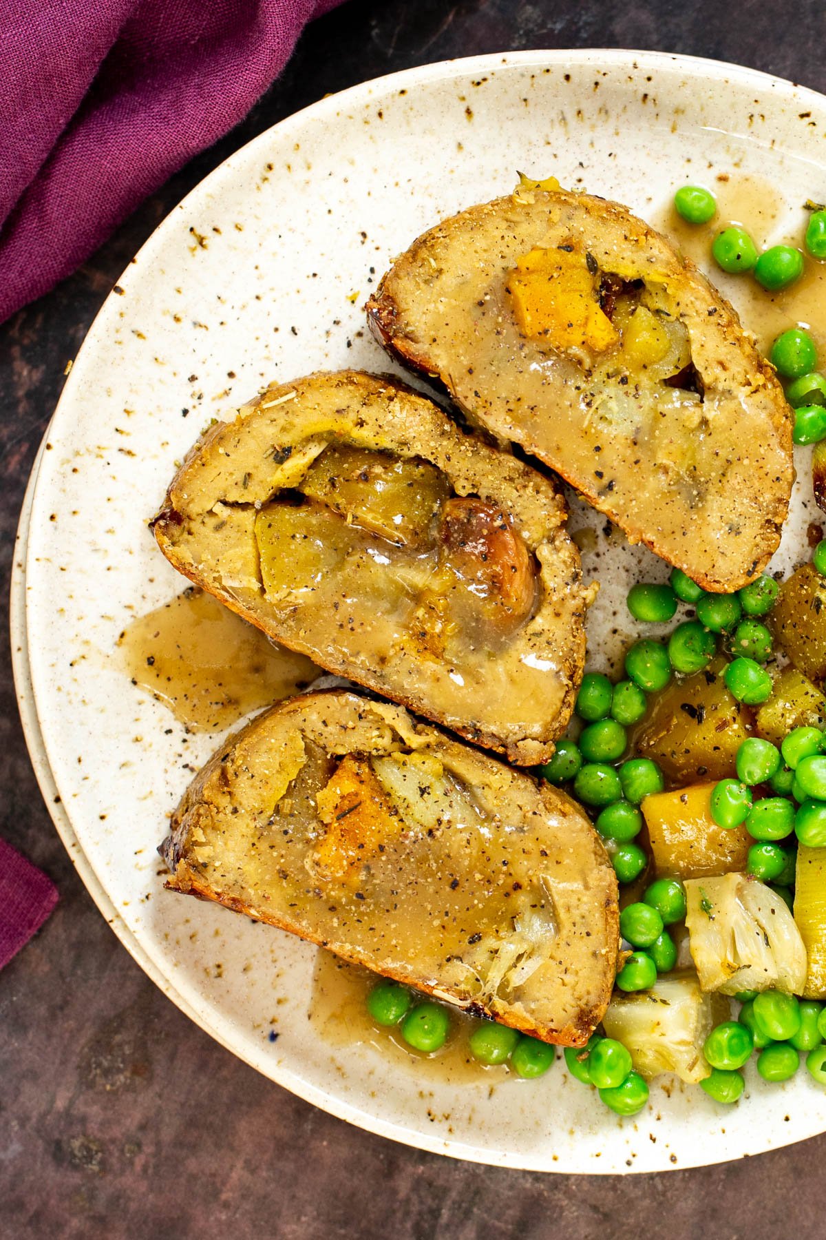 glutenfree holiday roast three slices of vegan glutenfree holiday roast with a side of veggies