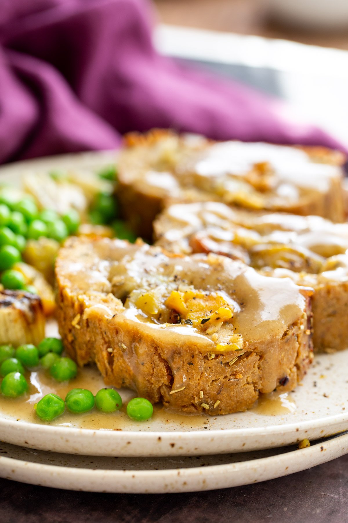 glutenfree nut roast three slices of vegan holiday nut roast filled with roasted vegetables