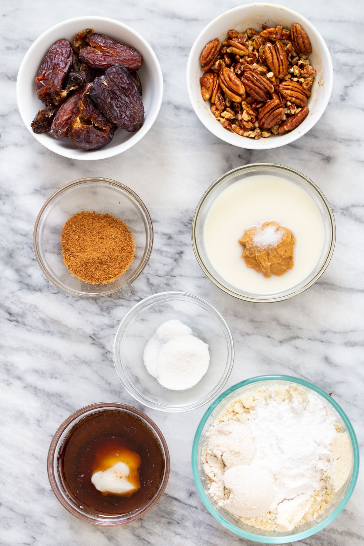 vegan pecan pie bars  ingredients for vegan pecan pie bars on a marble counter