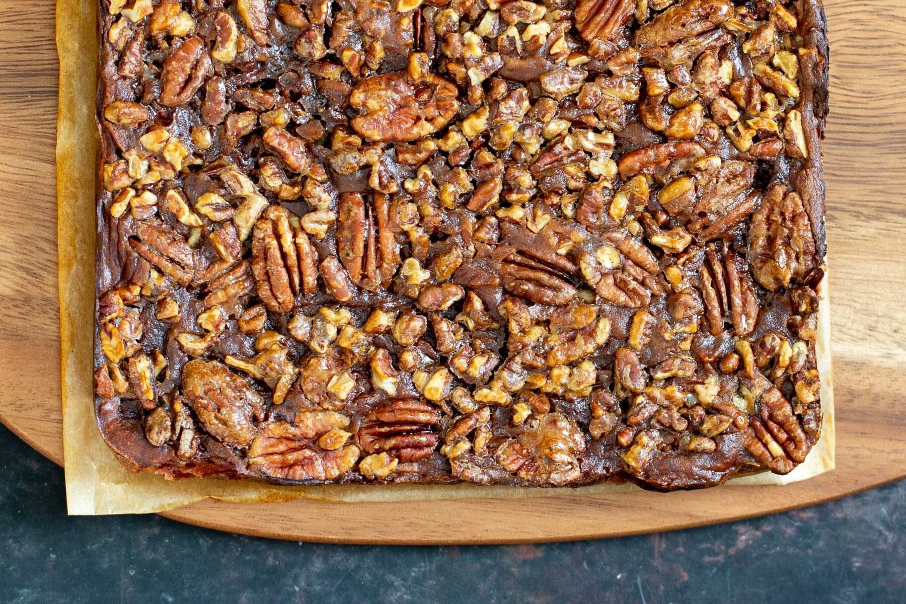 vegan pecan pie bars  vegan pecan pie bars on a wooden chopping board