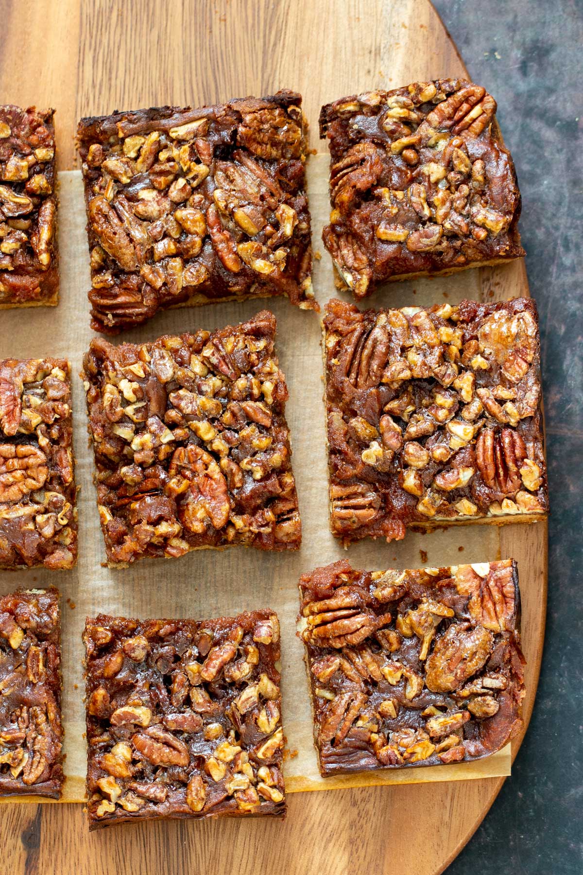 vegan pecan pie bars  vegan pecan pie bars on a wooden board