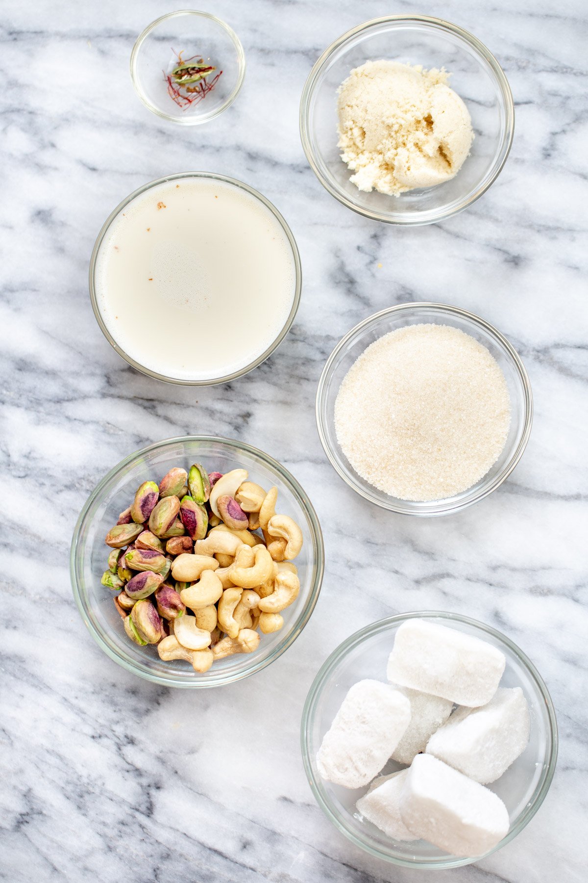 ingredients needed for making vegan rabri  Ingredients for Indian milk pudding rabri in bowls