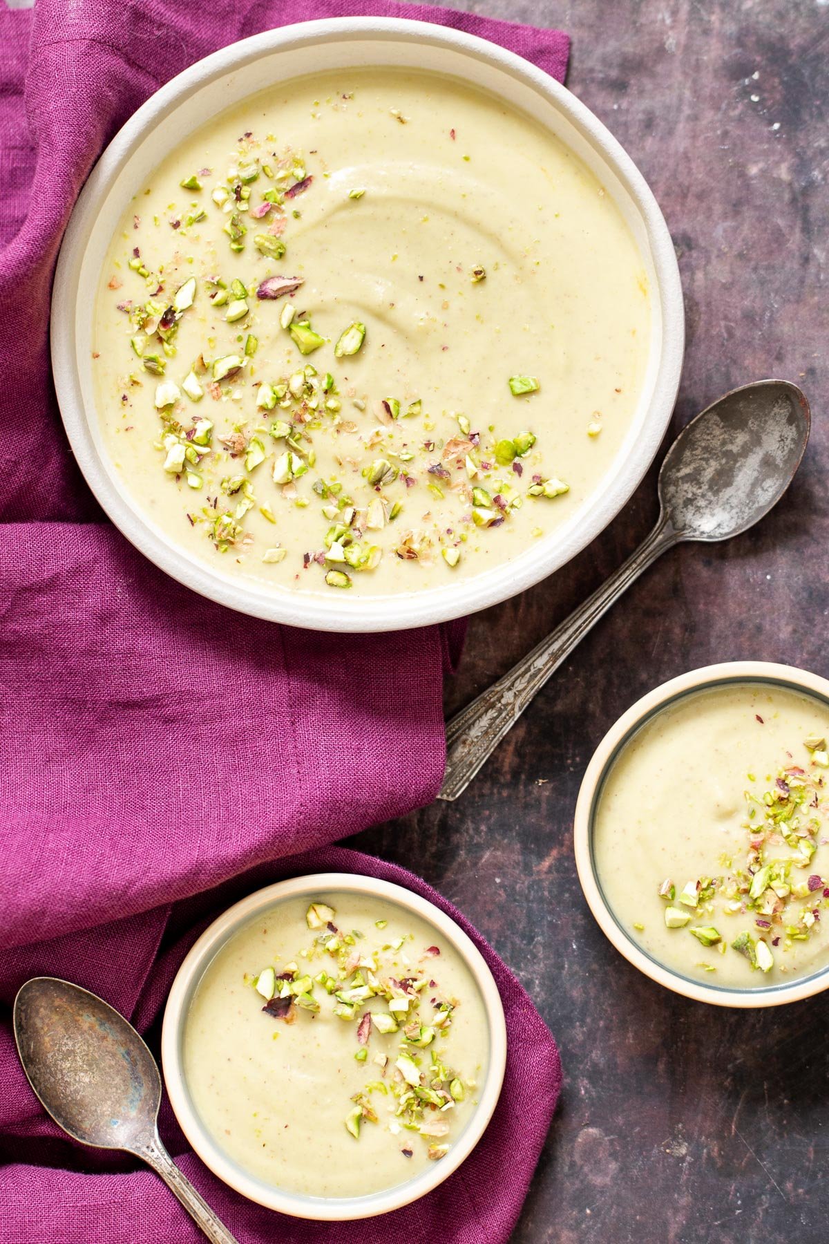 rabri recipe three servings of Indian Pudding Rabri topped with chopped pistachios