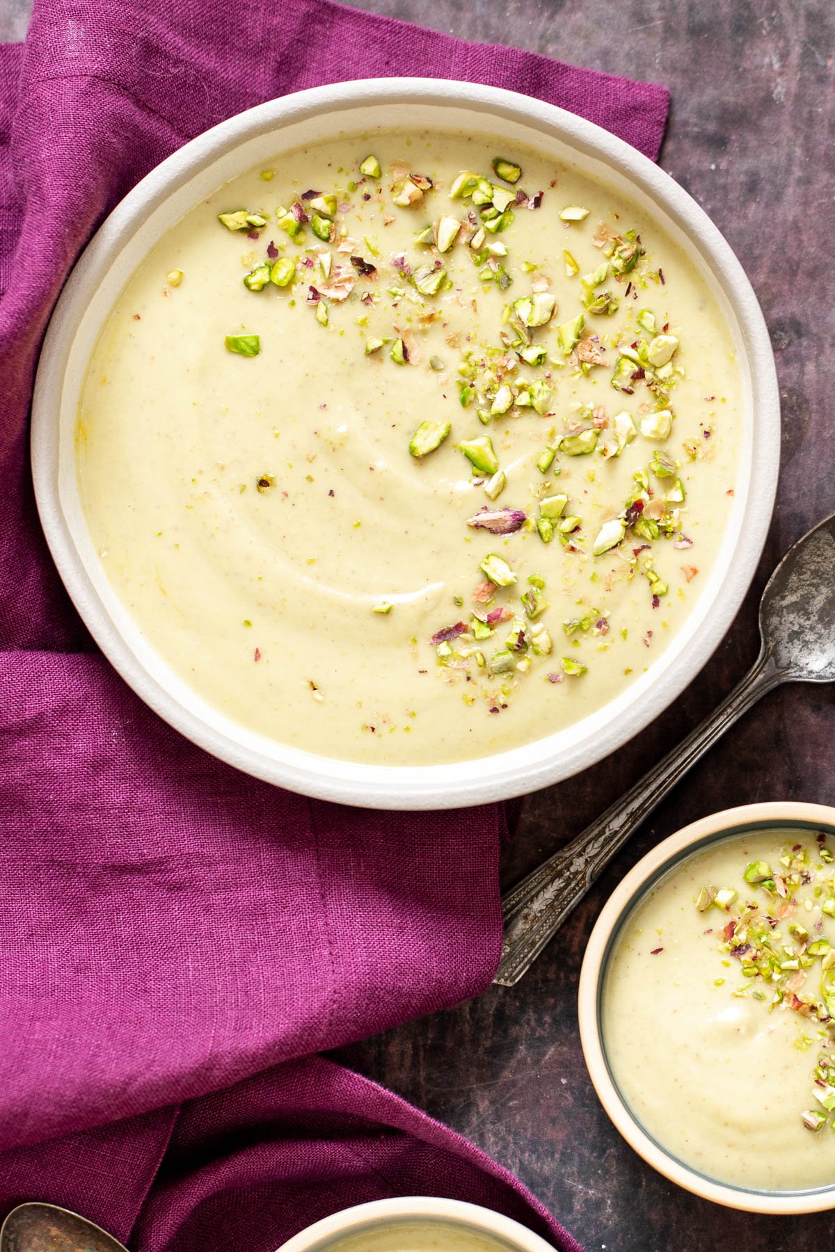 rabri recipe  three bowls of Indian rabri pudding chopped with pistachio