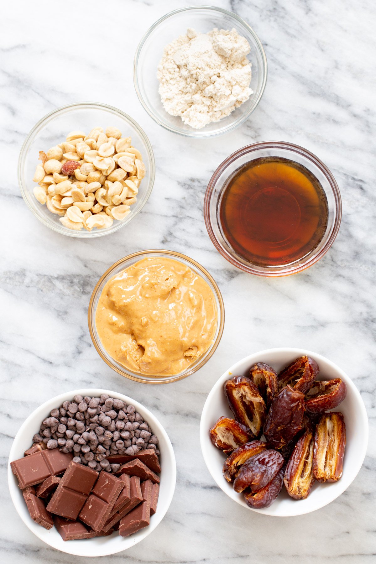 ingredients for vegan peanut butter cups on a marble slate