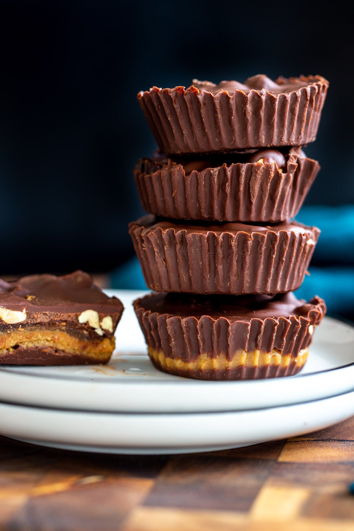 stacked vegan peanut butter cups with peanut butter nougat and dates