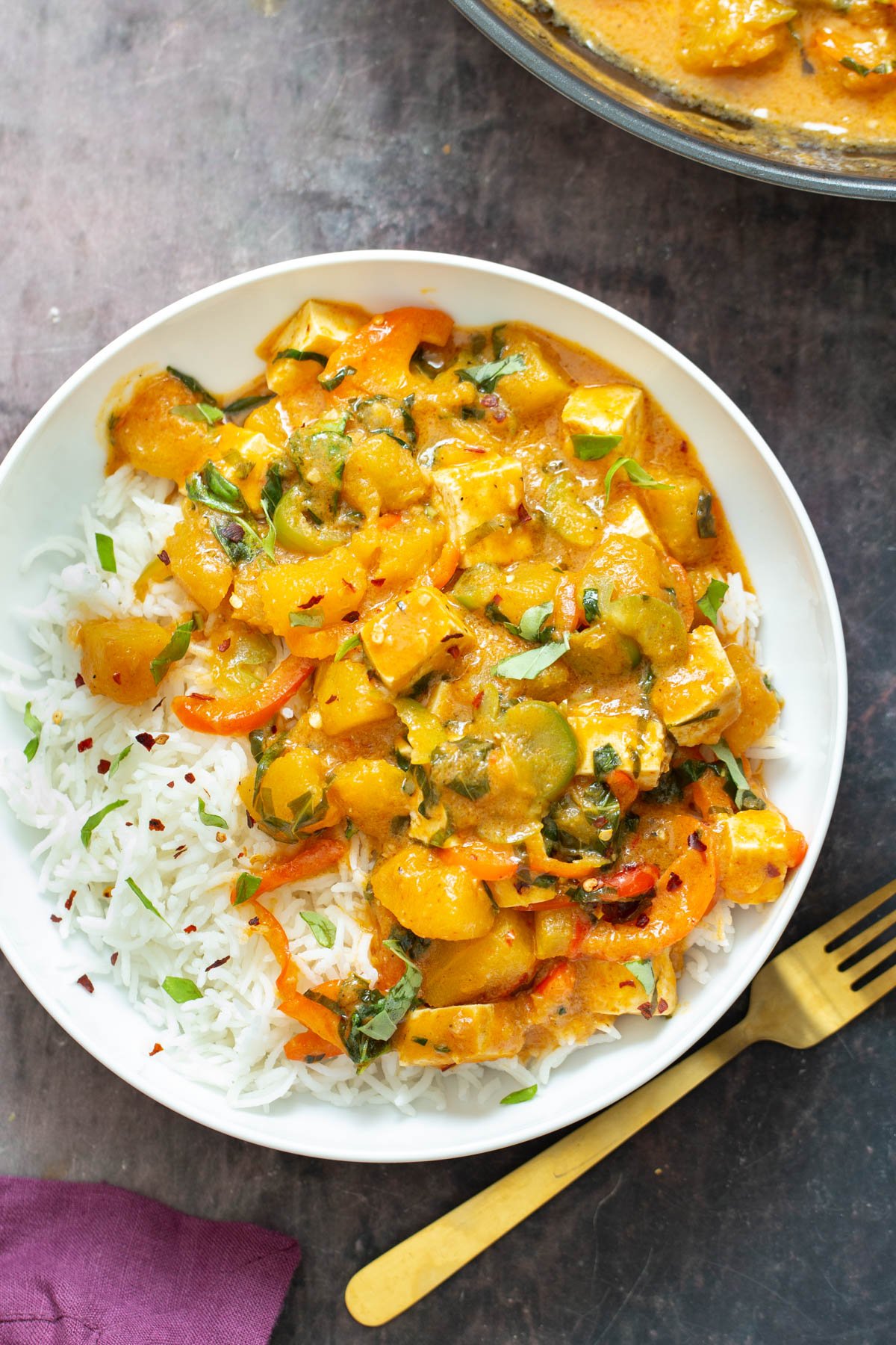 vegan pumpkin curry  vegan pumpkin curry with tofu served with a side of rice