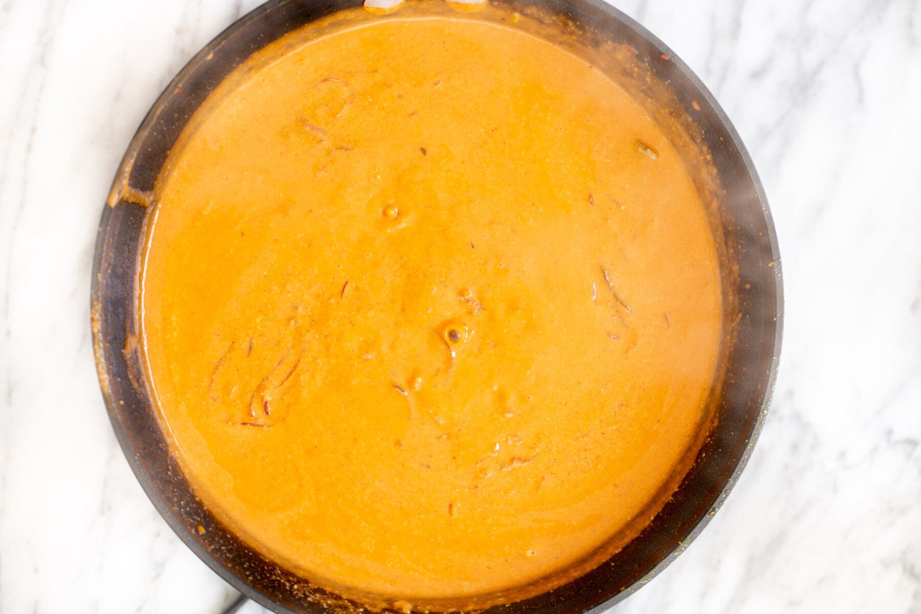 gravy for Indian Tofu Malai curry in a black skillet