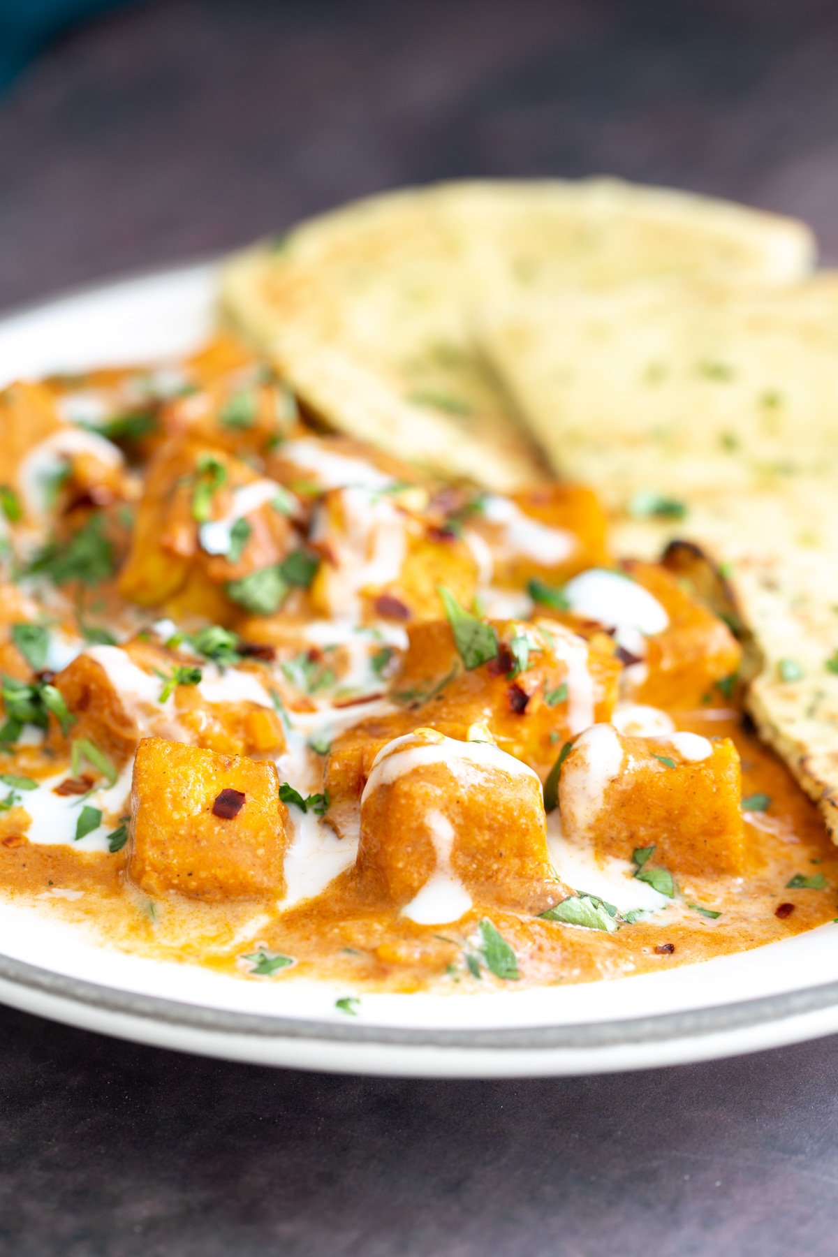 malai tofu  tofu malai curry drizzled with coconut cream served with a side of naan bread