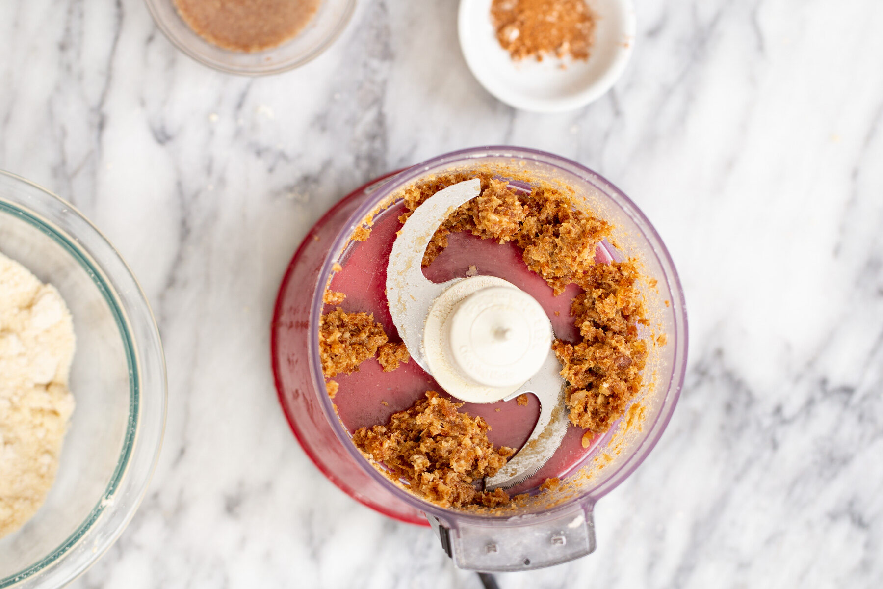 vegan gluten free pumpkin pie crust ingredients for vegan pie being blended in a food processor
