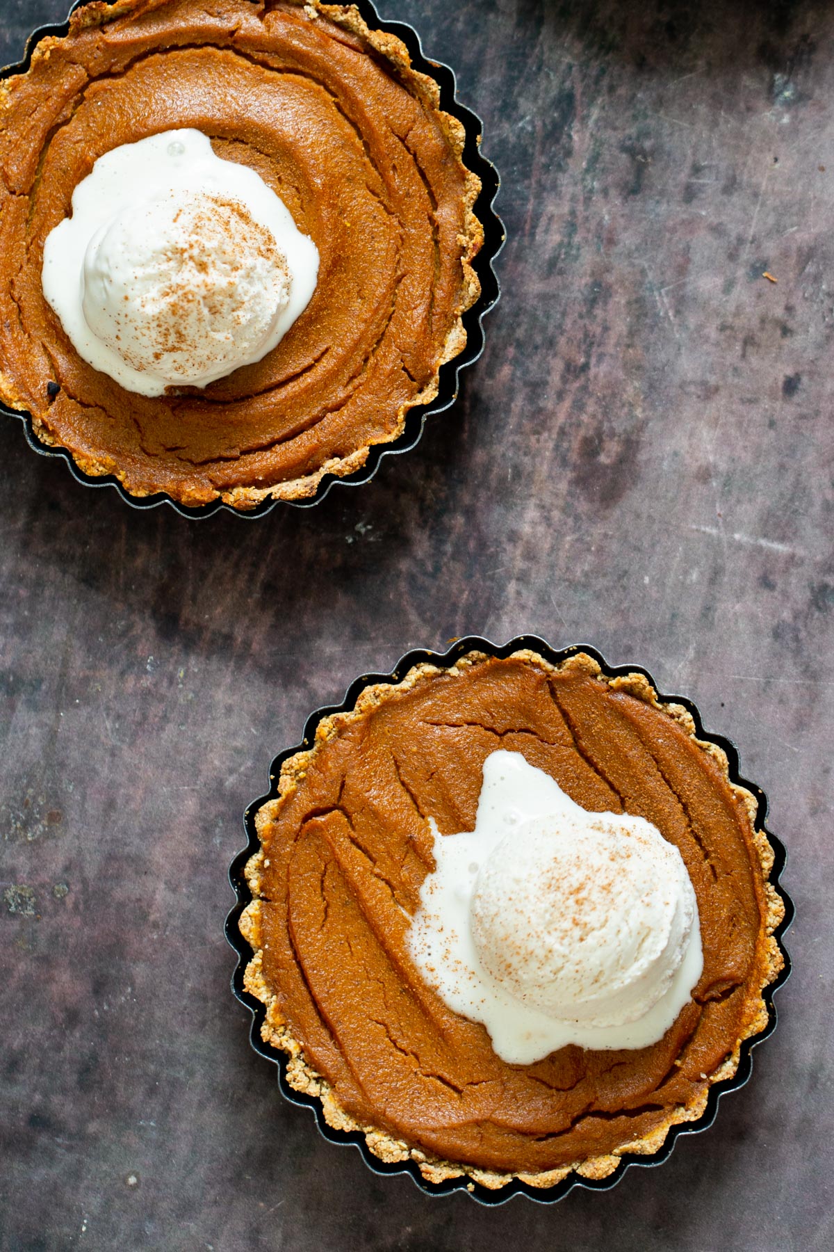 gluten free vegan pumpkin pie two gluten free vegan pumpkin pies topped with vanilla ice cream
